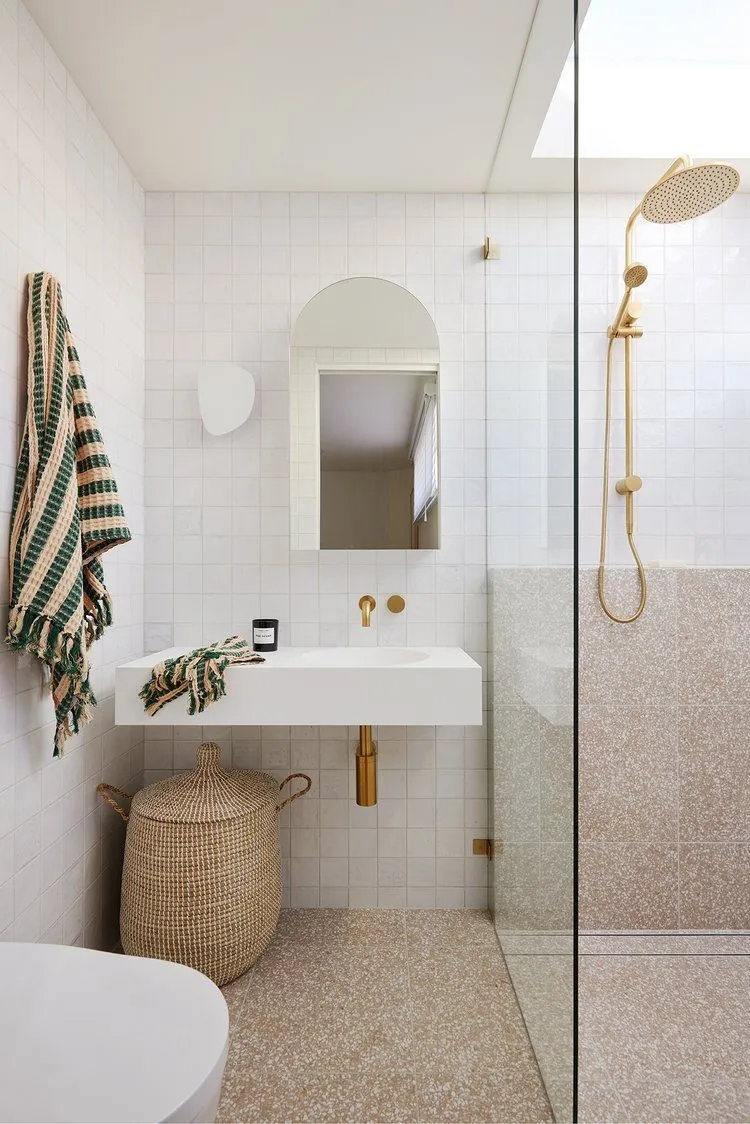 Renovated bathroom with quality tiling and brass fittings