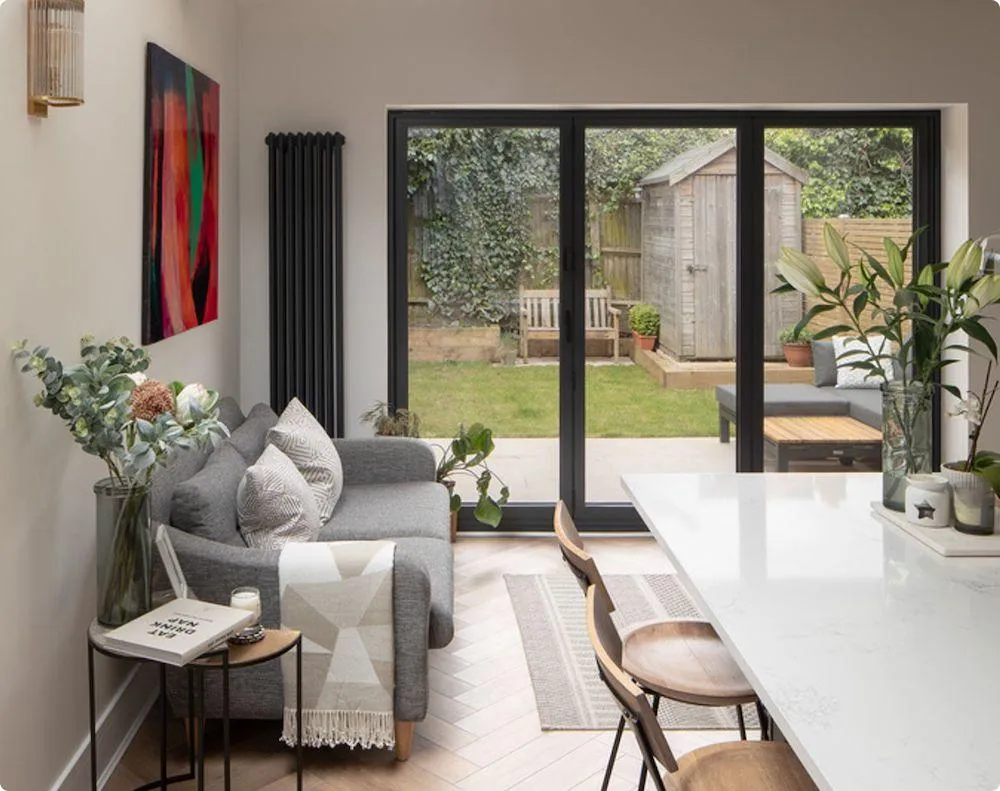 Open-plan living renovation connecting kitchen to garden